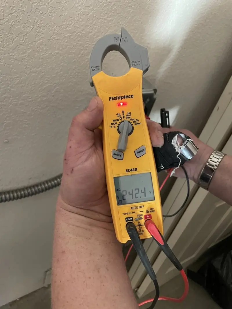 Voltage testing with clamp meter during Generator Installation in Wollochet